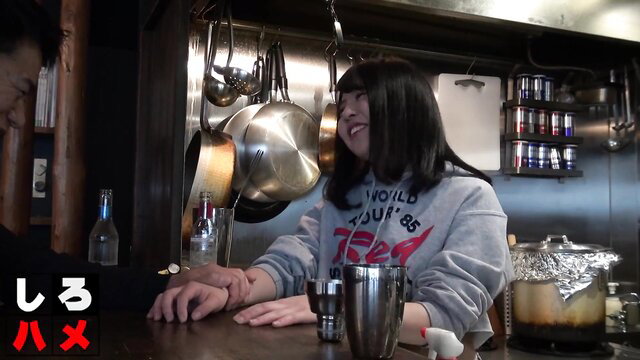Horny Japanese slut in grey hoodie at kitchen counter smiling