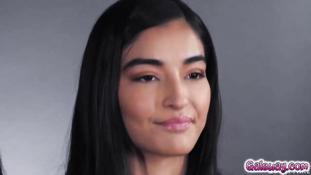 Emily Jane closeup smiling with bold lips and dark hair