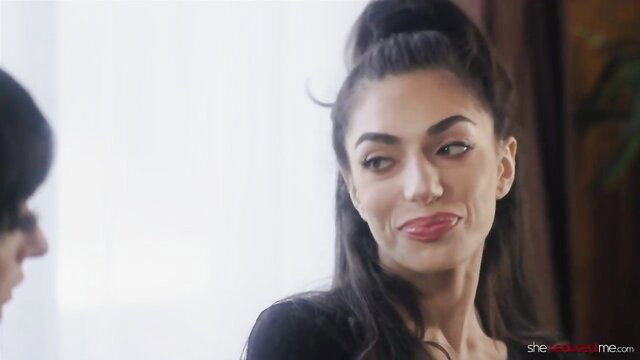 Darcie Dolce smirks seductively in Twisted Lesbian Games