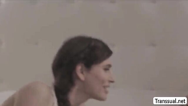 Ladyboy Ryder Monroe nude profile smiling on bed