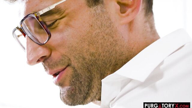 Handsome man in glasses and white shirt closeup portrait