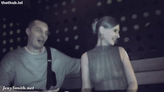 Jeny Smith in sparkly sheer dress with man outdoors at night