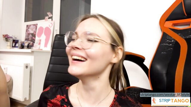 Blonde glasses girl smiling in red dress on stripTango cabaret stream