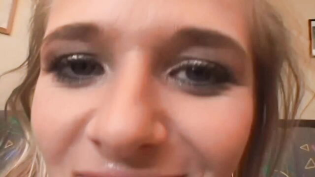 Closeup of young blonde woman with smoky eyes smiling in cum swallow vid thumbnail