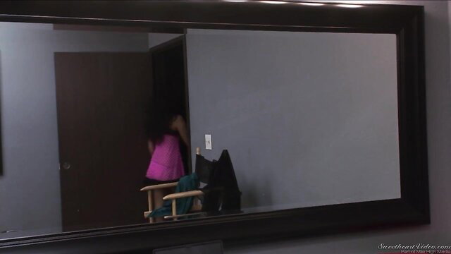Annie Cruz in pink dress reflected in mirror, Sinn Sage tease