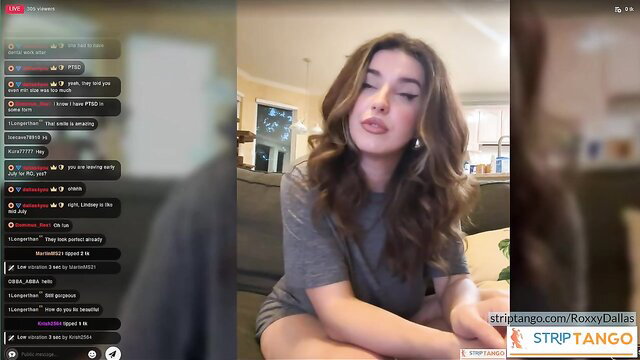 RoxxyDallas live cam tease in gray t-shirt, long wavy brown hair