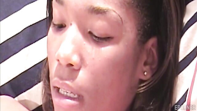 Closeup of retro black girl's aroused face with parted lips