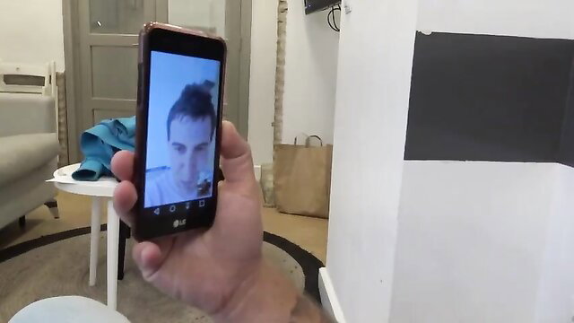 Tattooed Spanish whore POV selfie hand holding phone on bed