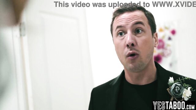 Shocked bride in black suit faces man before wedding romp