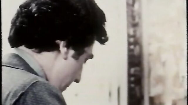 Close-up of handsome 1980s Italian man in vintage erotic film Confessioni immorali