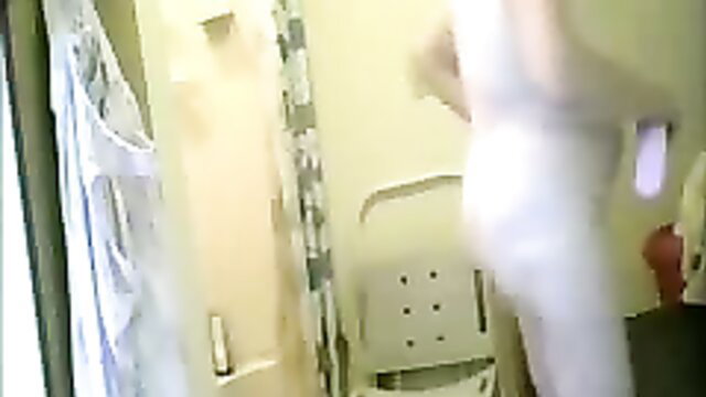 Granny drying naked body after shower, wet mature curves