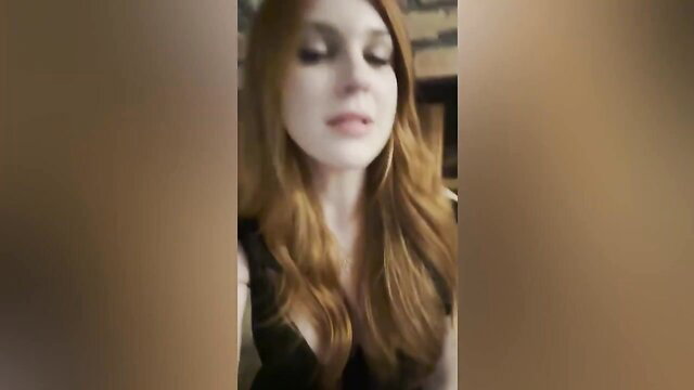 Redhead mommy Olive Wood in low-cut black dress giving sex advice