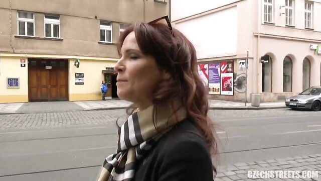Czech Streets redhead American super mom walks urban street in scarf coat