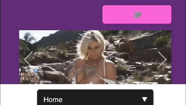 Blonde bombshell in skimpy top poses seductively on rocky desert landscape