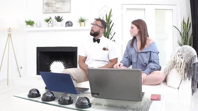 Will Pounder and brunette babe on laptops in sexy home setup