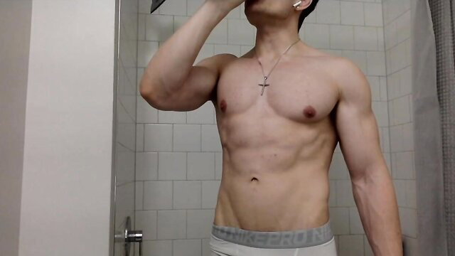 Buff Asian guy Tylerhero23 in underwear flexing muscles in shower