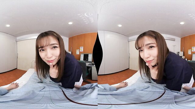 Hairy Asian beauty in seductive VR pose on bed, teasing smile