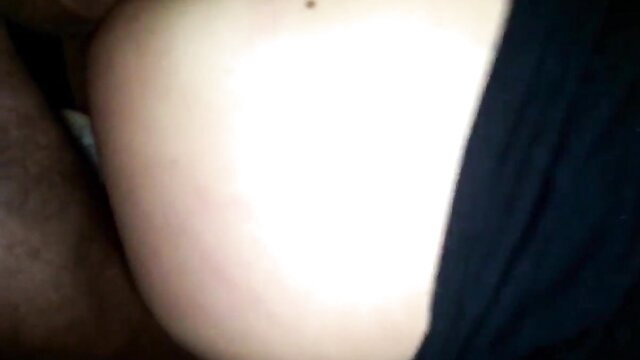 Closeup of thick white woman's pale hip and ass in dimly lit amateur gay porn thumbnail