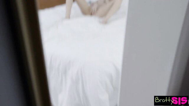 Riley Reid on bed in white panties, hot Bratty Sis pose