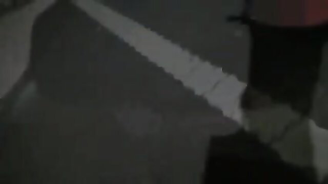 Blurry exhibitionist couple having public sex on road