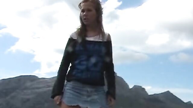 German amateur redhead babe in skirt outdoors on mountain