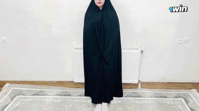 Persian hijab girl in black chador standing modestly