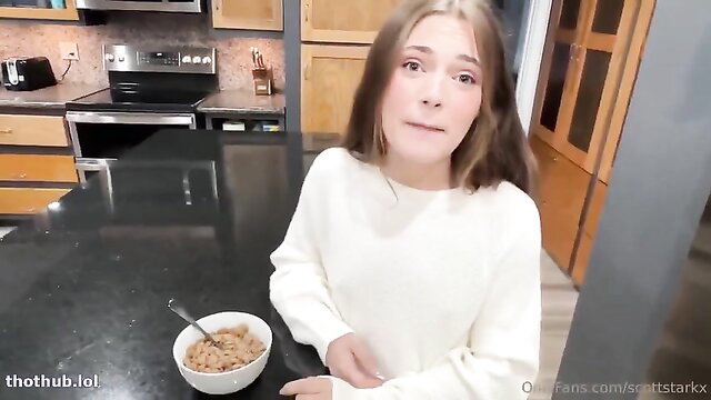 Juniper Ren in white sweater holding cereal bowl, cute face
