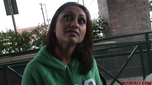 Priya Rai in green hoodie, seductive gaze outdoors