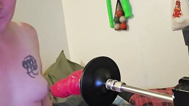 Tattooed white girl preps ridged pink monster dildo machine for booty destruction