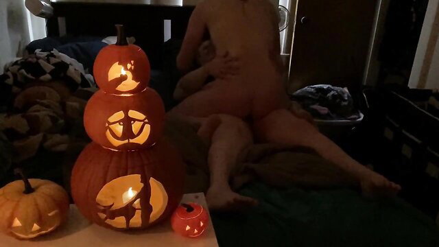 Hot blonde fucked doggystyle on bed amid Halloween jack-o-lanterns