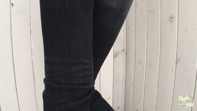 Slender-legged Asian babe rips tight jeans for easy access