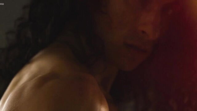 Closeup of muscular Black man's sensual face and toned shoulders in steamy gay scene