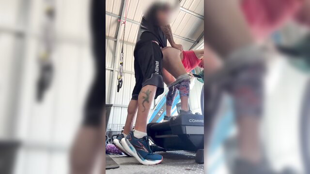 Tattooed man interrupts workout for quick gym sex with woman