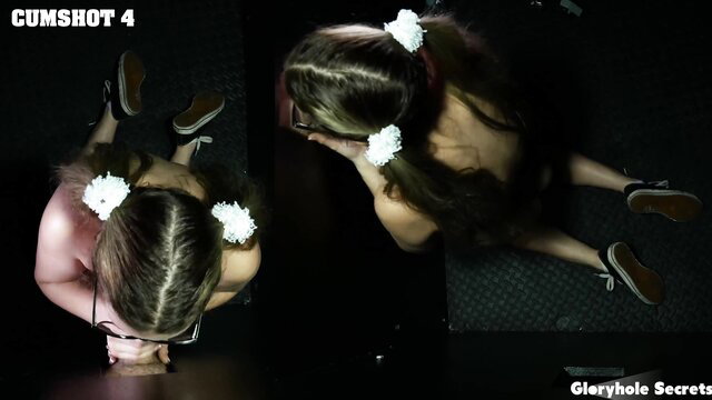 Teen with pigtails kneels covered in cum at gloryhole