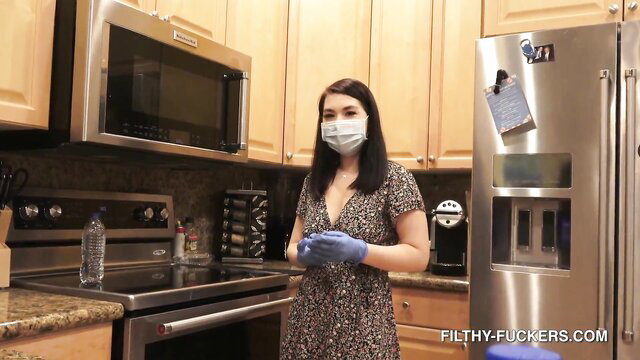 Mina Moon sexy Asian maid in dress and gloves in kitchen