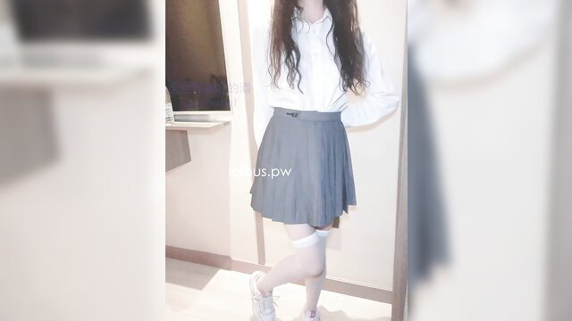 Asian teen in white shirt, gray pleated skirt, white thigh-high stockings, posing sexy
