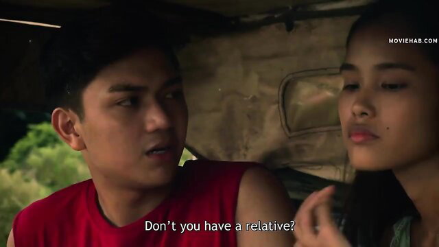 Filipino couple in red tank top chats intimately in car, Vivamax style