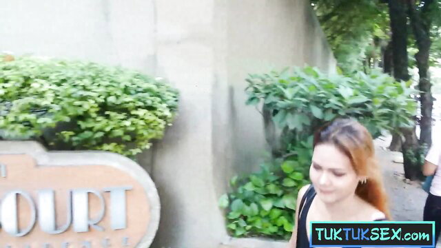 Blonde Thai MILF cutie smiles outside Court Hotel on amateur video