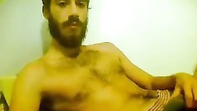 Scruffy bearded guy shows off hairy muscular body solo