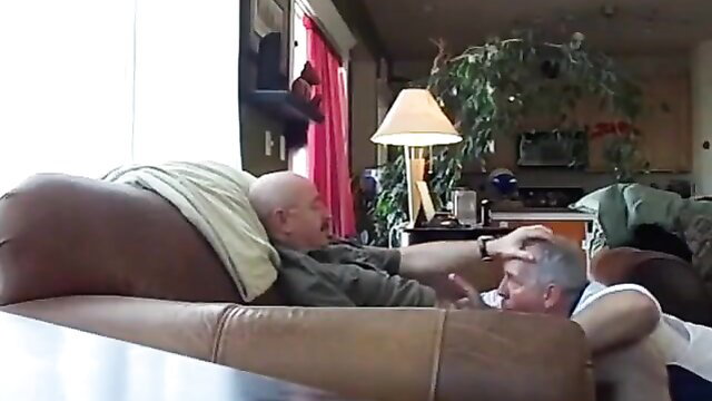 Two muscular silver fox daddies cuddling on couch in Silver Fox Servicer 2