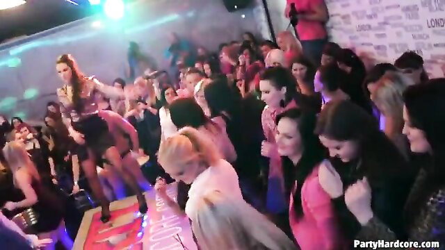 Crowd of hot women dancing wild at insane fuckfest party rave