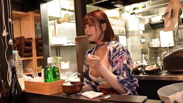 Japanese AV idol in sexy kimono licks spoon at bar, teasing cleavage