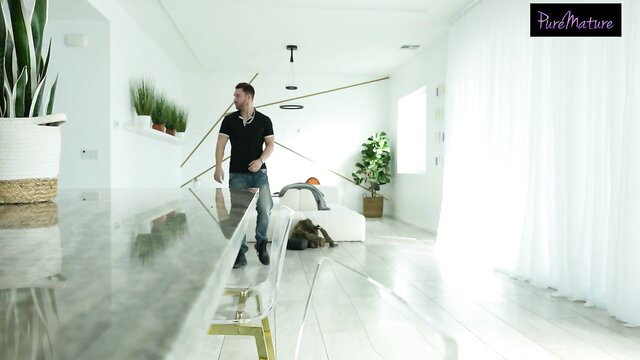 Handsome Latin man in white room walks confidently in VR porn preview