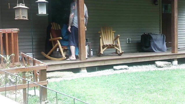 Amateur neighbors caught on porch - tatted guy in shorts, barefoot girl rocking nude