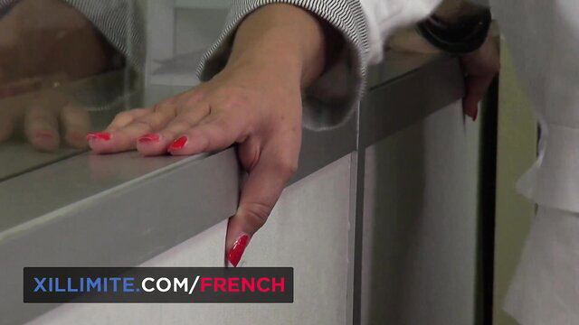 Sabrina Sweet busty secretary hand on desk red nails closeup