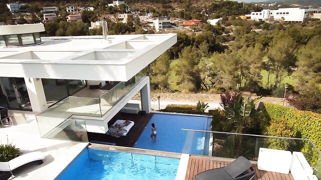 Ginebra Bellucci nude by infinity pool in luxurious outdoor villa