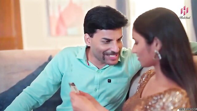 Indian couple in intimate embrace, big boobs maid in gold saree