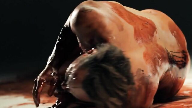 Gory horror scene from Cephalic Carnage Ohrwurm video, bloodied twisted body