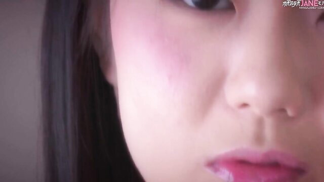 Closeup of tempting Asian teen's glossy lips and blushing cheeks