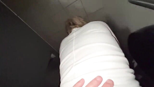 Blonde wife bent over in public restroom, hand on ass before creampie fuck